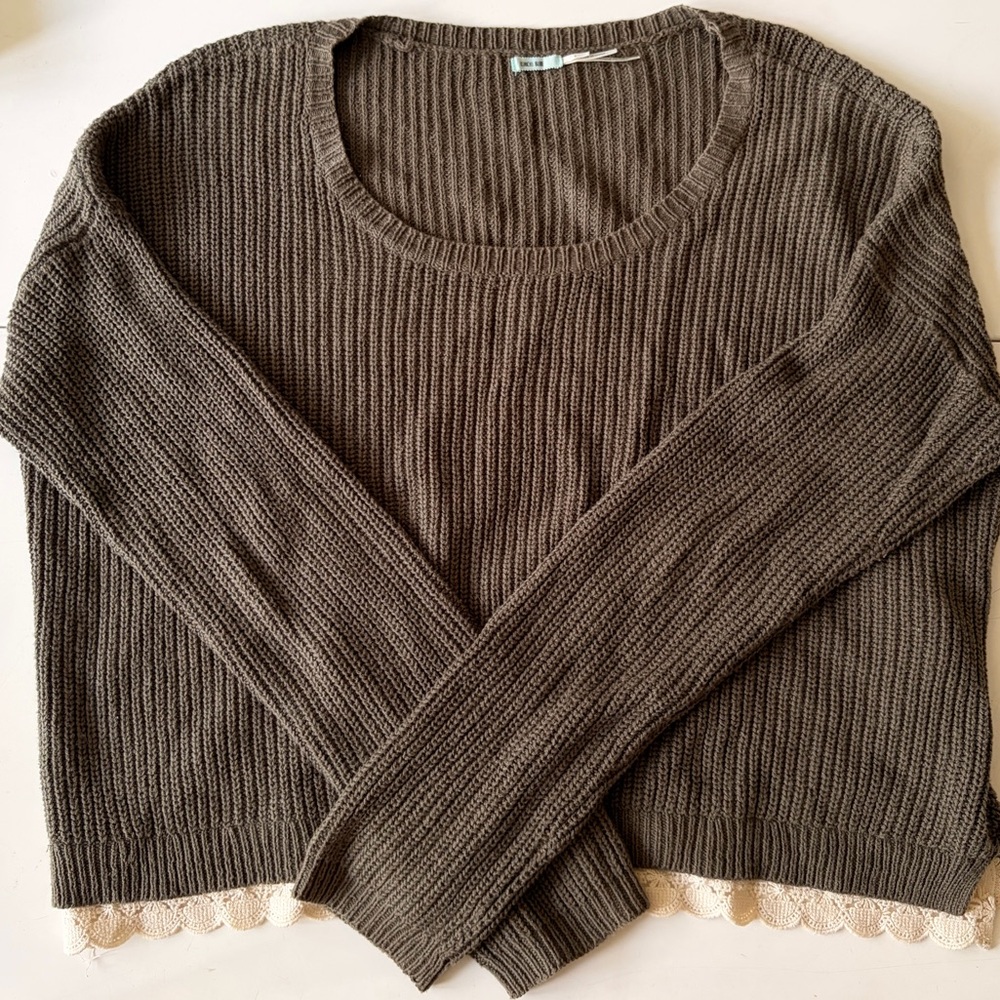 Army green color Kimchi Blue sweater with lace detail on bottom